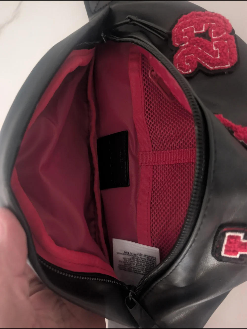 Nike Black Sling Bag with Red Logo Patch